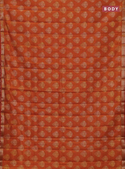 Semi raw silk saree rustic orange with allover floral butta prints and small zari woven border