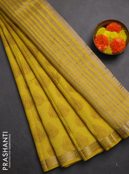 Semi raw silk saree mustard yellow shade with allover floral butta prints and small zari woven border