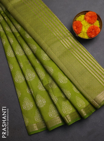 Semi raw silk saree light green with allover floral butta prints and small zari woven border