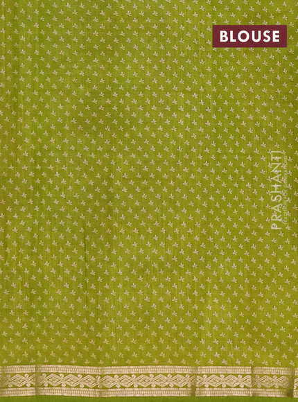 Semi raw silk saree light green with allover floral butta prints and small zari woven border
