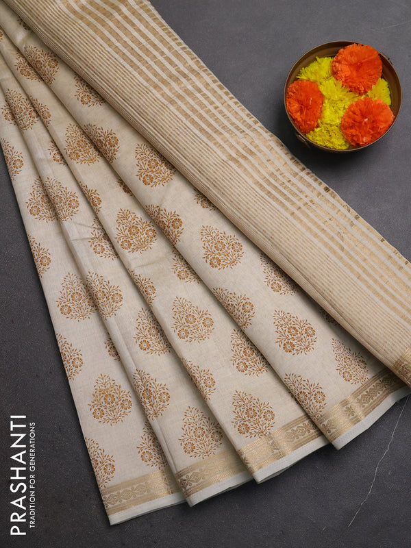 Semi raw silk saree cream with allover floral butta prints and small zari woven border