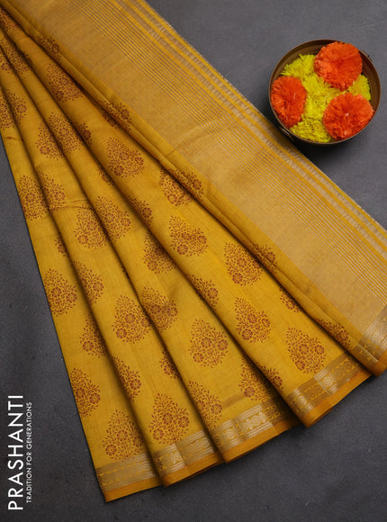 Semi raw silk saree mustard yellow with allover floral butta prints and small zari woven border