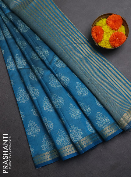 Semi raw silk saree teal blue with allover floral butta prints and small zari woven border