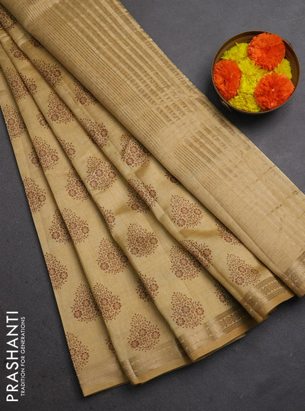 Semi raw silk saree sandal with allover floral butta prints and small zari woven border