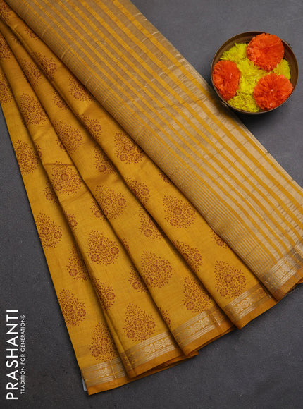 Semi raw silk saree dark mustard with allover floral butta prints and small zari woven border