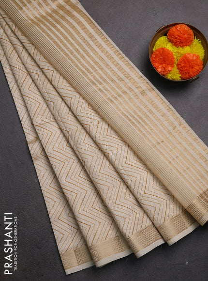 Semi raw silk saree cream with allover zigzag prints and zari woven border