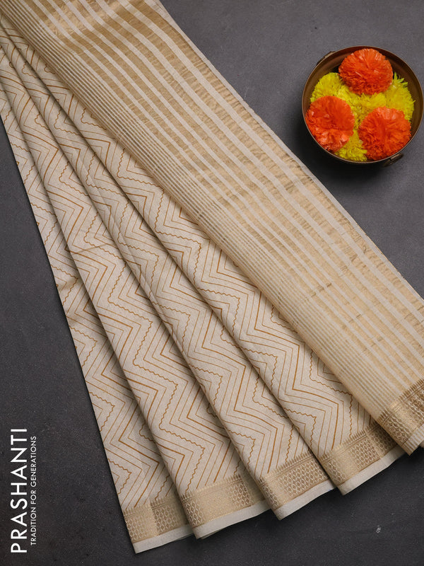 Semi raw silk saree cream with allover zigzag prints and zari woven border