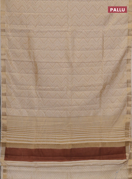 Semi raw silk saree cream with allover zigzag prints and zari woven border