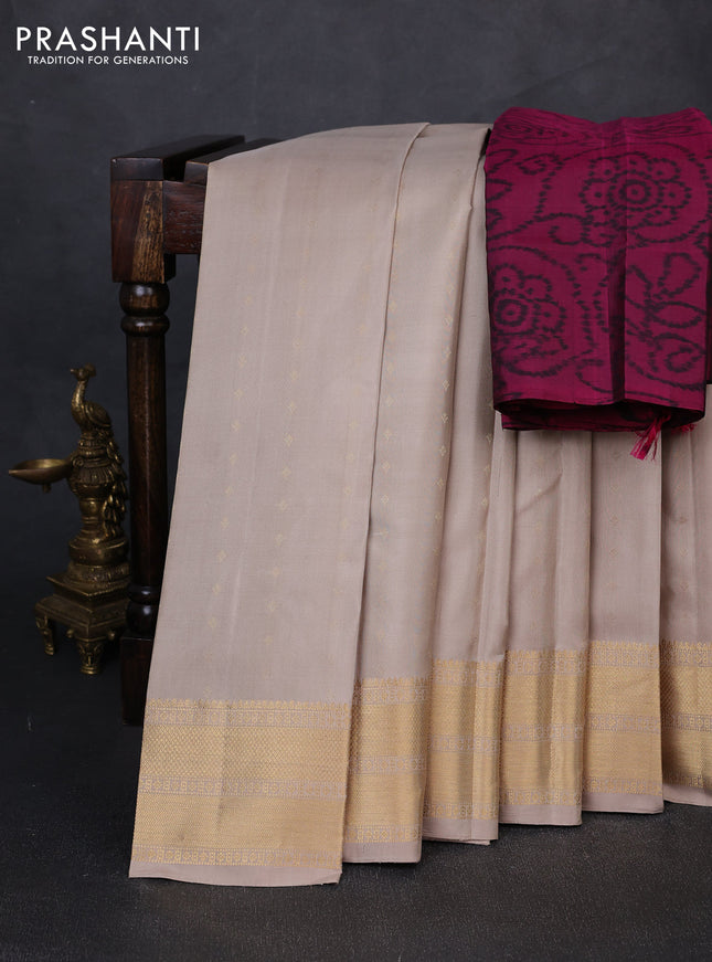 Pure soft silk saree beige and magenta pink with allover zari woven buttas and zari woven border