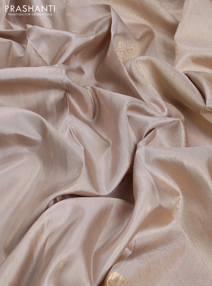 Pure soft silk saree beige and magenta pink with allover zari woven buttas and zari woven border
