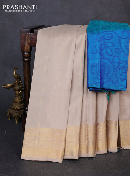 Pure soft silk saree beige and teal green with allover zari woven buttas and zari woven border