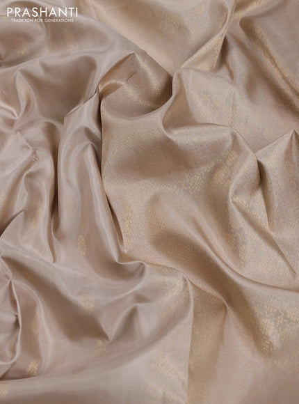 Pure soft silk saree beige and teal green with allover zari woven buttas and zari woven border