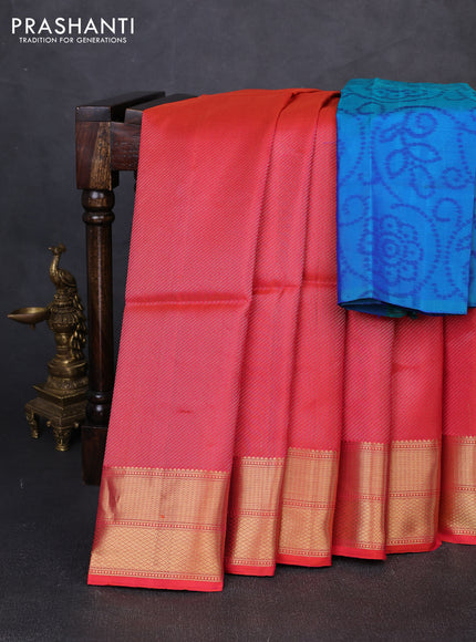Pure soft silk saree dual shade of pinkish orange and teal blue with allover zari woven brocade weaves and zari woven border