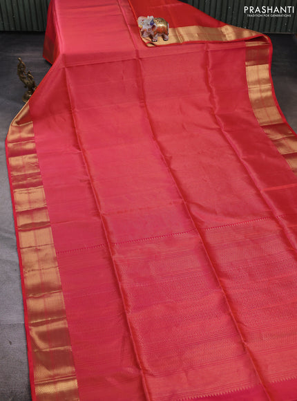 Pure soft silk saree dual shade of pinkish orange and teal blue with allover zari woven brocade weaves and zari woven border