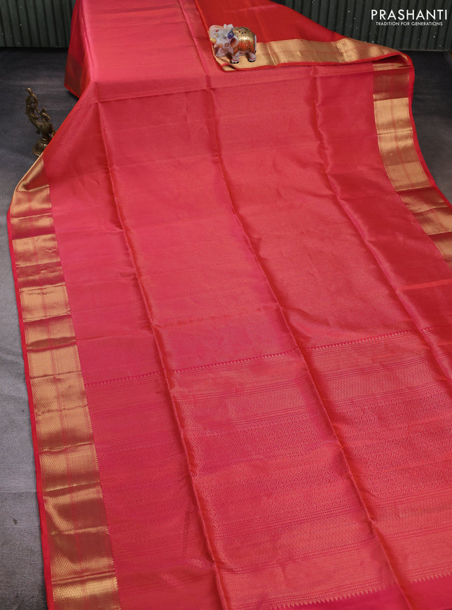 Pure soft silk saree dual shade of pinkish orange and teal blue with allover zari woven brocade weaves and zari woven border