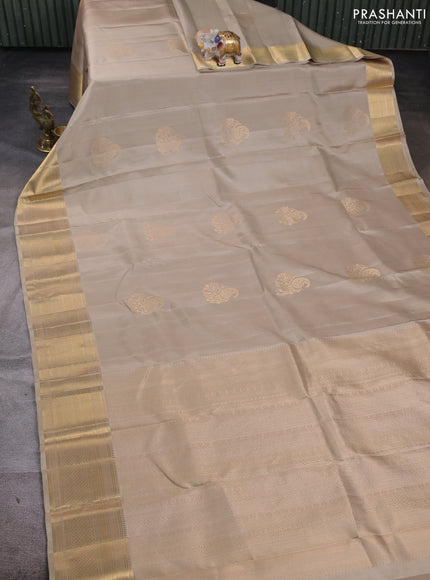 Pure soft silk saree beige and beige shade with paisley zari woven buttas and zari woven border
