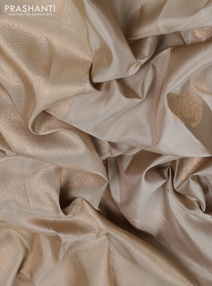 Pure soft silk saree beige and beige shade with paisley zari woven buttas and zari woven border