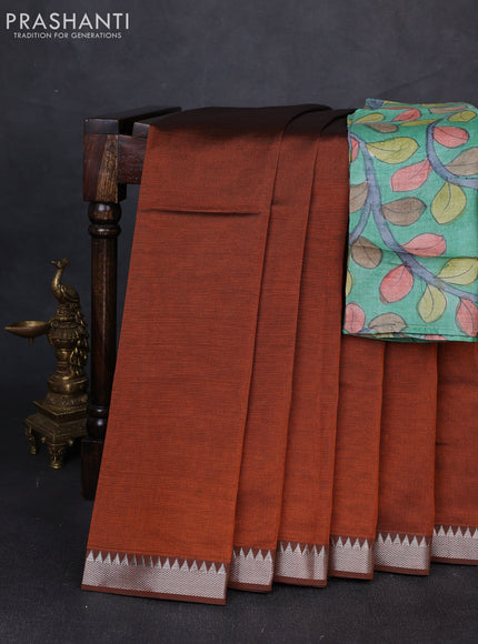 Mangalgiri silk cotton saree rust shade and green with plain body and temple design silver zari woven border