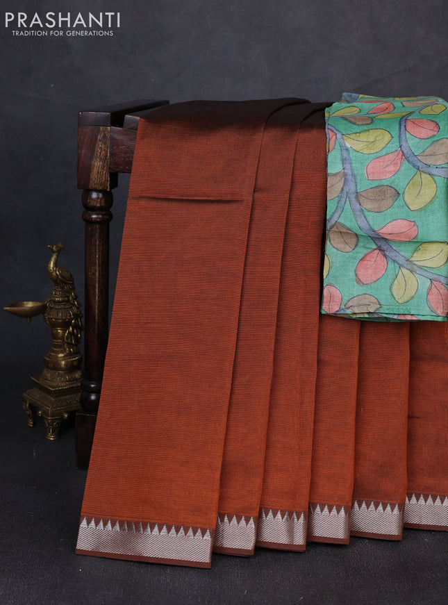 Mangalgiri silk cotton saree rust shade and green with plain body and temple design silver zari woven border
