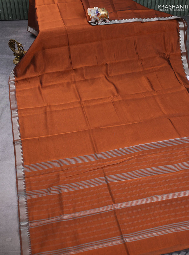 Mangalgiri silk cotton saree rust shade and green with plain body and temple design silver zari woven border
