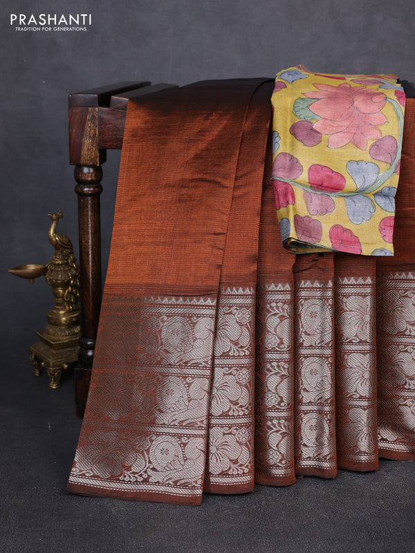 Mangalgiri silk cotton saree rust shade and mustard yellow with plain body and long temple design silver zari woven border