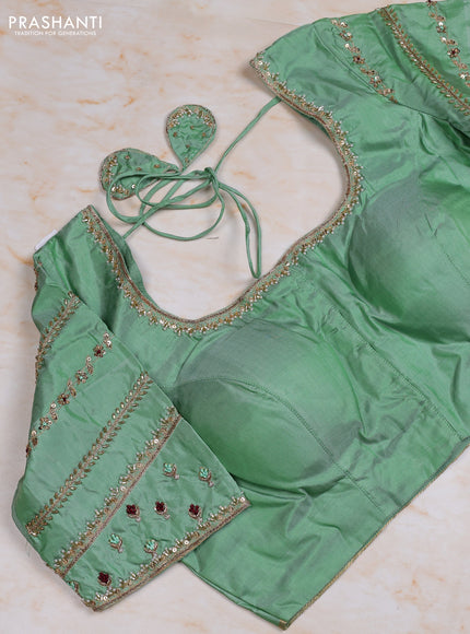 Pure kanchipuram silk saree purple and pastel green with allover zari woven buttas and simple zari woven border with Aari work blouse