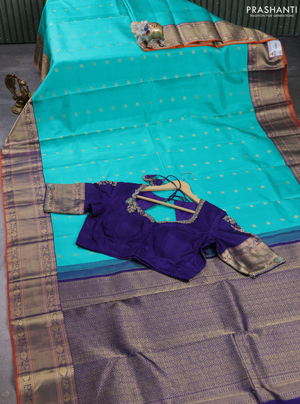 Pure kanchipuram silk saree teal green and navy blue with allover zari woven buttas and zari woven korvai border with Aari work blouse