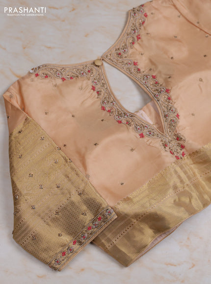 Pure kanchipuram silk saree peach pink and pastel peach with zari woven buttas and long zari woven border with Aari work blouse