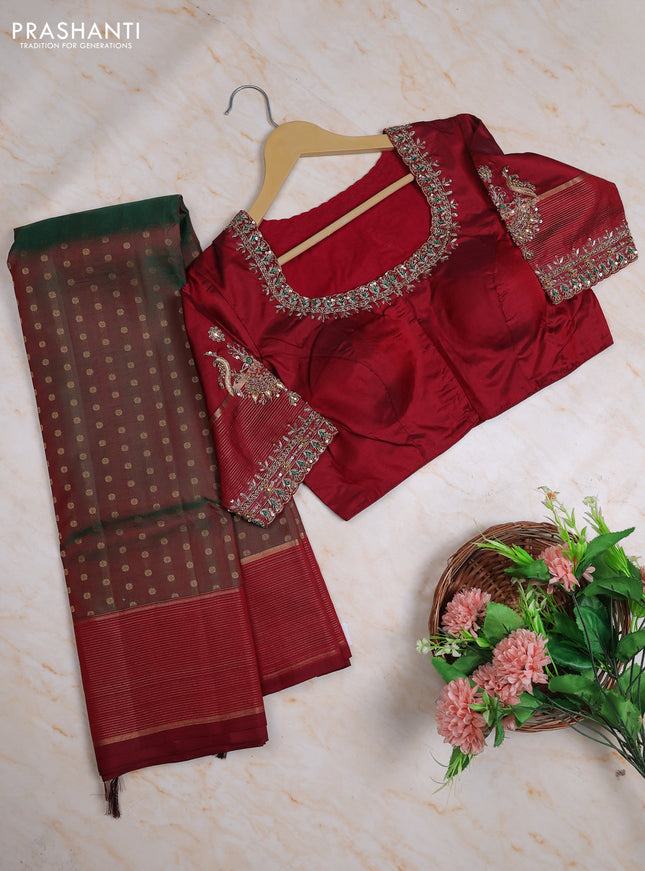 Pure kanchipuram silk saree dual shade of green and maroon with allover zari woven buttas and zari woven border with Aari work blouse