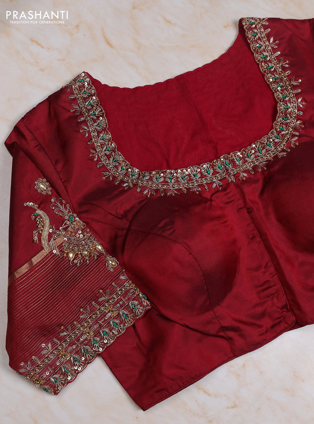 Pure kanchipuram silk saree dual shade of green and maroon with allover zari woven buttas and zari woven border with Aari work blouse