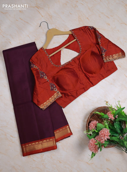 Pure kanchipuram silk saree deep wine and rust shade with plain body and small temple zari woven border with Aari work blouse