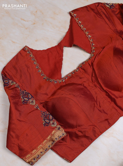 Pure kanchipuram silk saree deep wine and rust shade with plain body and small temple zari woven border with Aari work blouse
