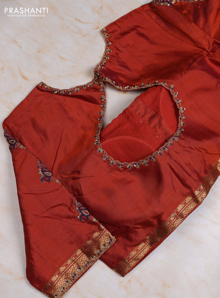 Pure kanchipuram silk saree deep wine and rust shade with plain body and small temple zari woven border with Aari work blouse