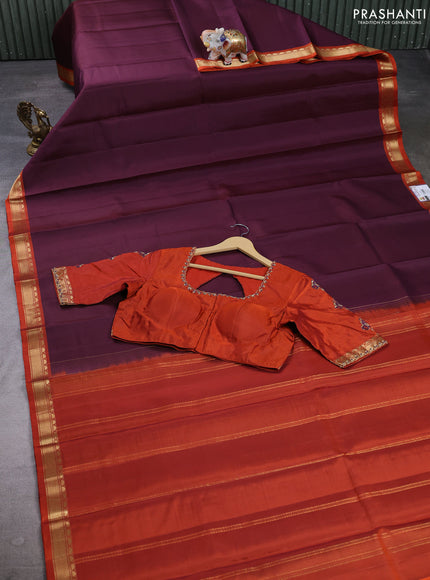 Pure kanchipuram silk saree deep wine and rust shade with plain body and small temple zari woven border with Aari work blouse