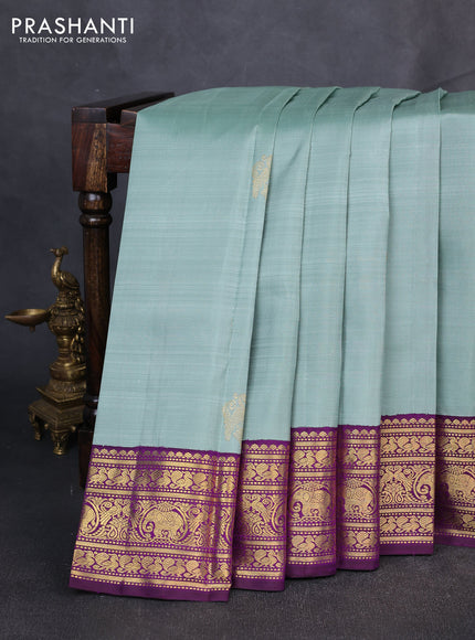 Puer kanchipuram silk saree pastel green and purple with zari woven buttas and zari woven korvai boredr