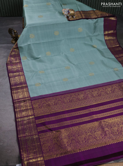 Puer kanchipuram silk saree pastel green and purple with zari woven buttas and zari woven korvai boredr