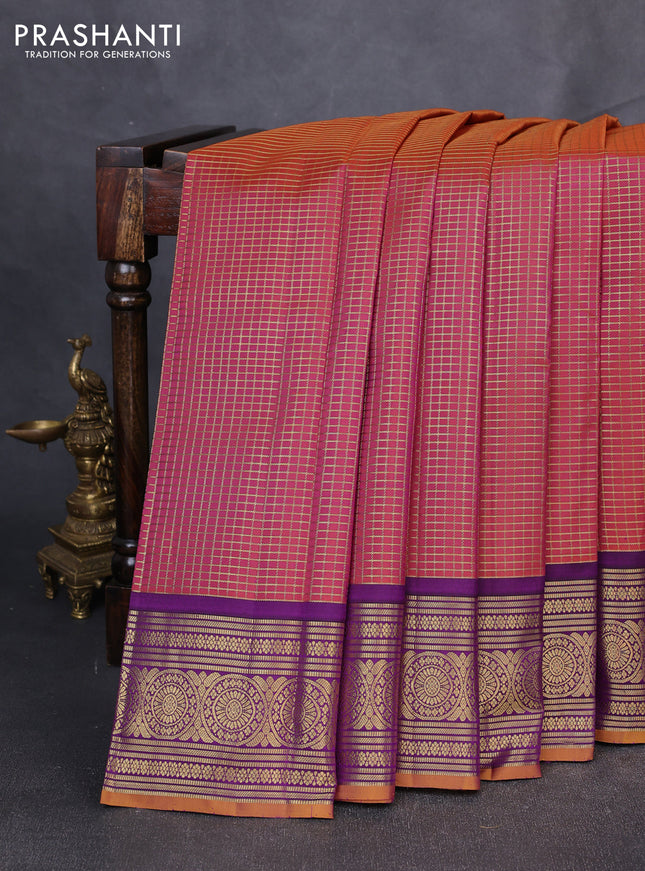 Pure kanchipuram silk saree dual shade of rust and mustard yellow with allover small zari checked pattern and zari woven korvai border