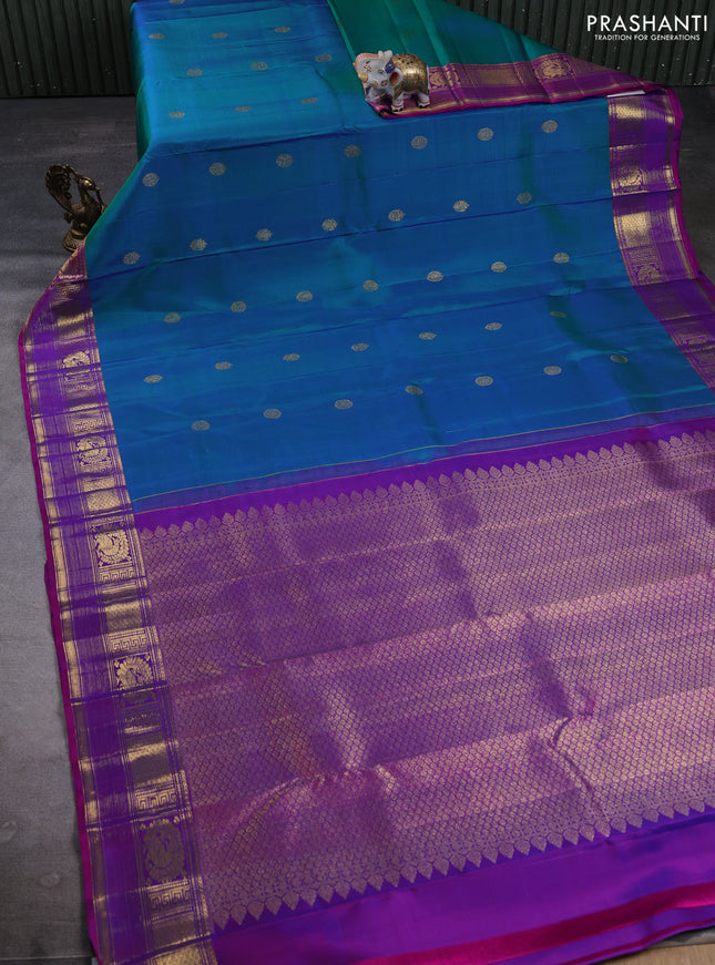 Pure kanchipuram silk saree dual shade of bluish green and pink with zari woven buttas and zari woven border