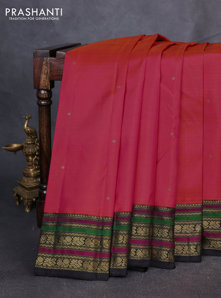 Puer kanchipuram silk saree dual shade of pinkish orange and black with zari woven buttas and zari woven border