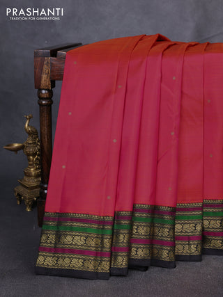 Pure kanchipuram silk saree dual shade of pinkish orange and black with zari woven buttas and zari woven border