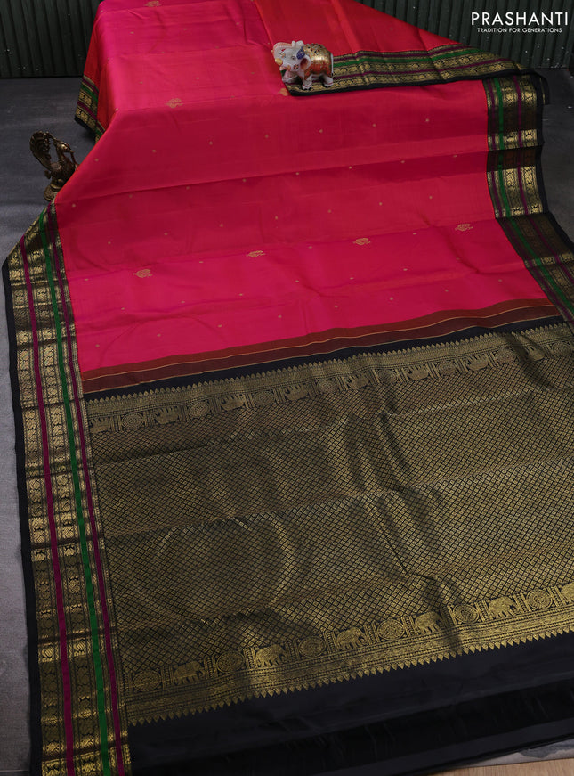 Pure kanchipuram silk saree dual shade of pinkish orange and black with zari woven buttas and zari woven border