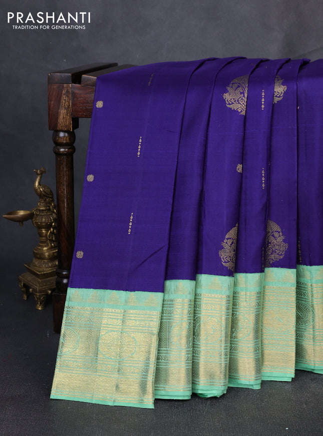 Pure kanchipuram silk saree blue and pastel green with zari woven buttas and long zari woven korvai border