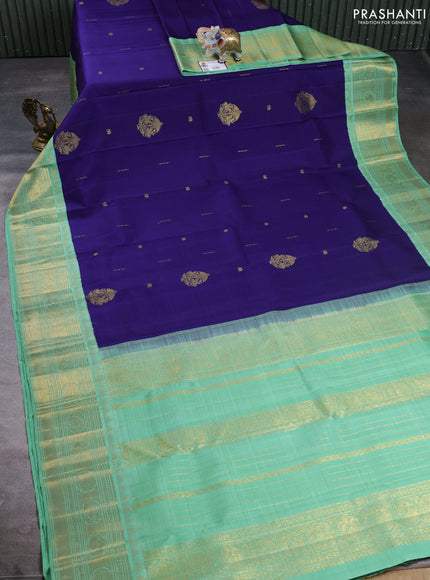 Puer kanchipuram silk saree blue and pastel green with zari woven buttas and long zari woven korvai border