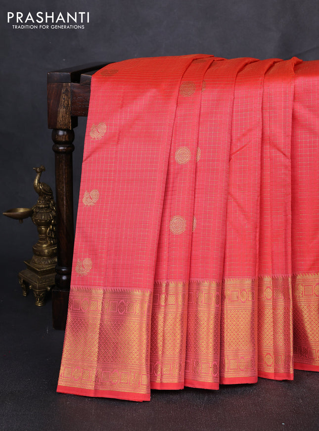 Pure kanchipuram silk saree peach orange with allover small zari checks & buttas and zari woven border