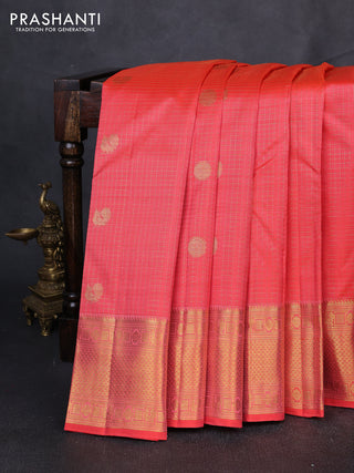 Pure kanchipuram silk saree peach orange with allover small zari checks & buttas and zari woven border