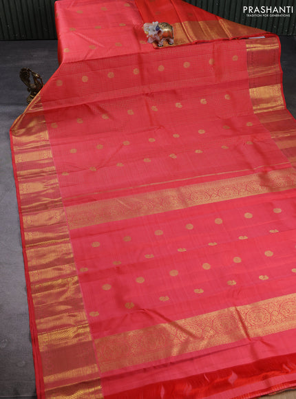 Puer kanchipuram silk saree peach orange with allover small zari checks & buttas and zari woven border