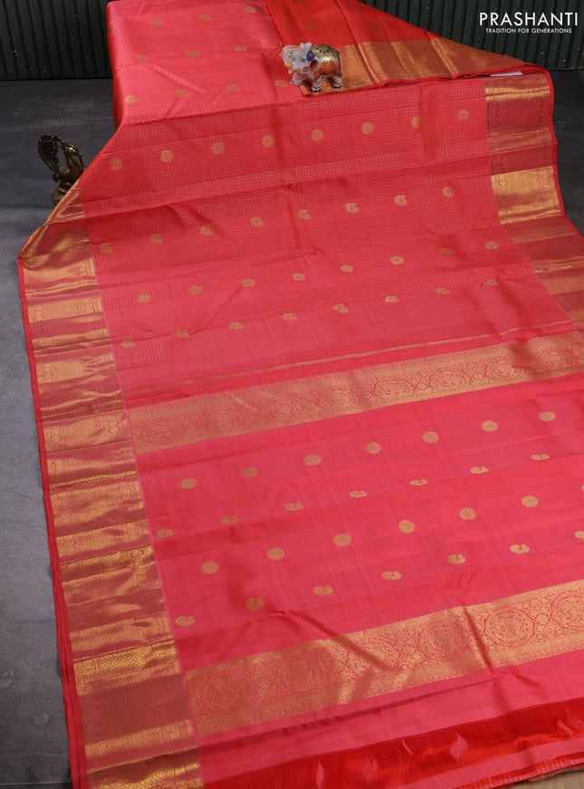 Pure kanchipuram silk saree peach orange with allover small zari checks & buttas and zari woven border