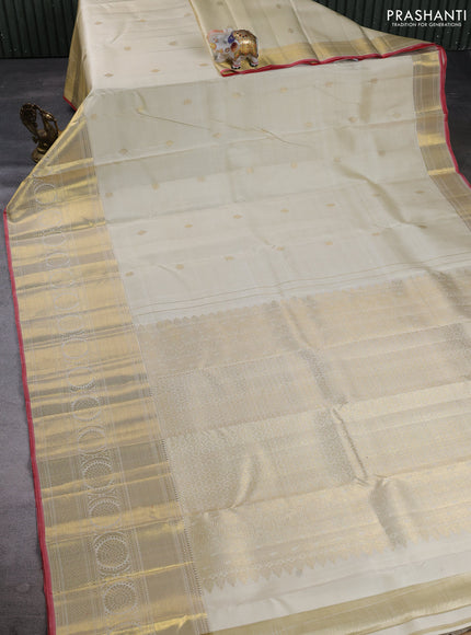 Puer kanchipuram silk saree cream with allover zari woven buttas and long zari woven border