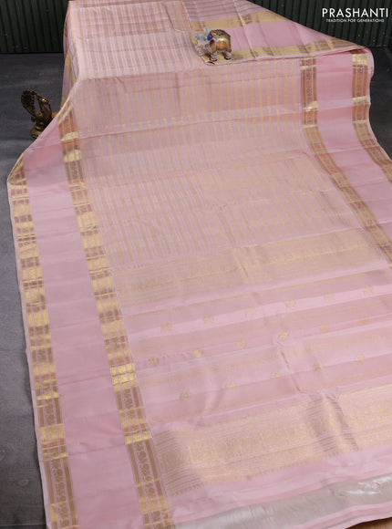 Puer kanchipuram silk saree pastel pink with allover zari weaves and long rettapet zari woven border
