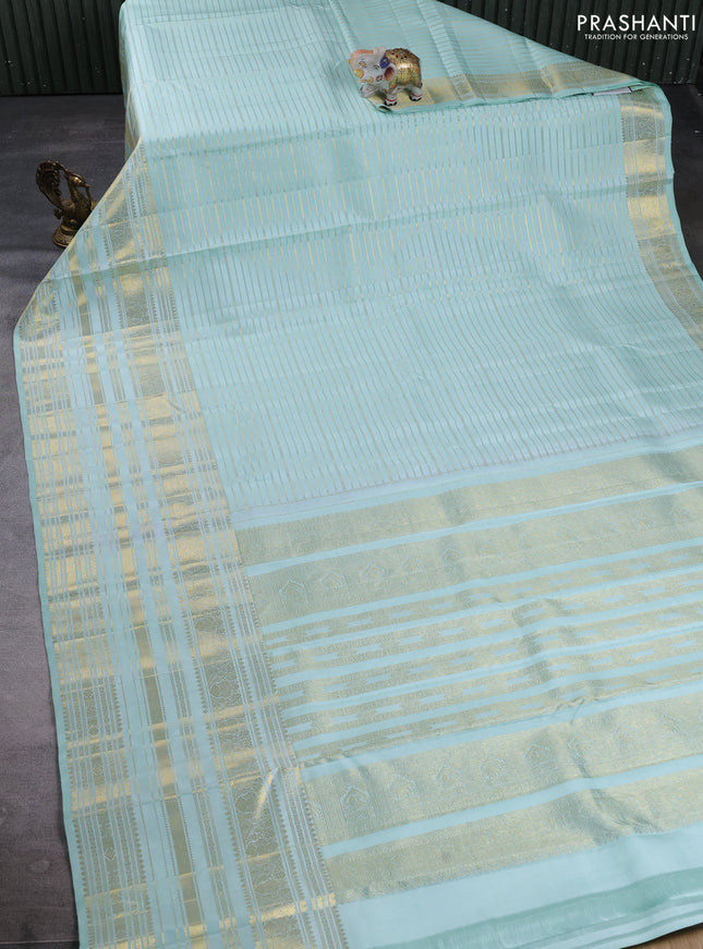 Pure kanchipuram silk saree mild teal with allover zari weaves and long zari woven border